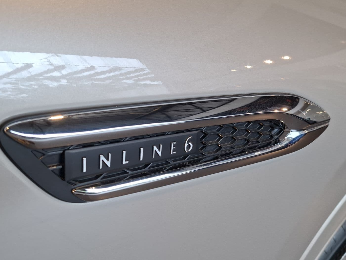 Inline 6 engine badge on a front fender