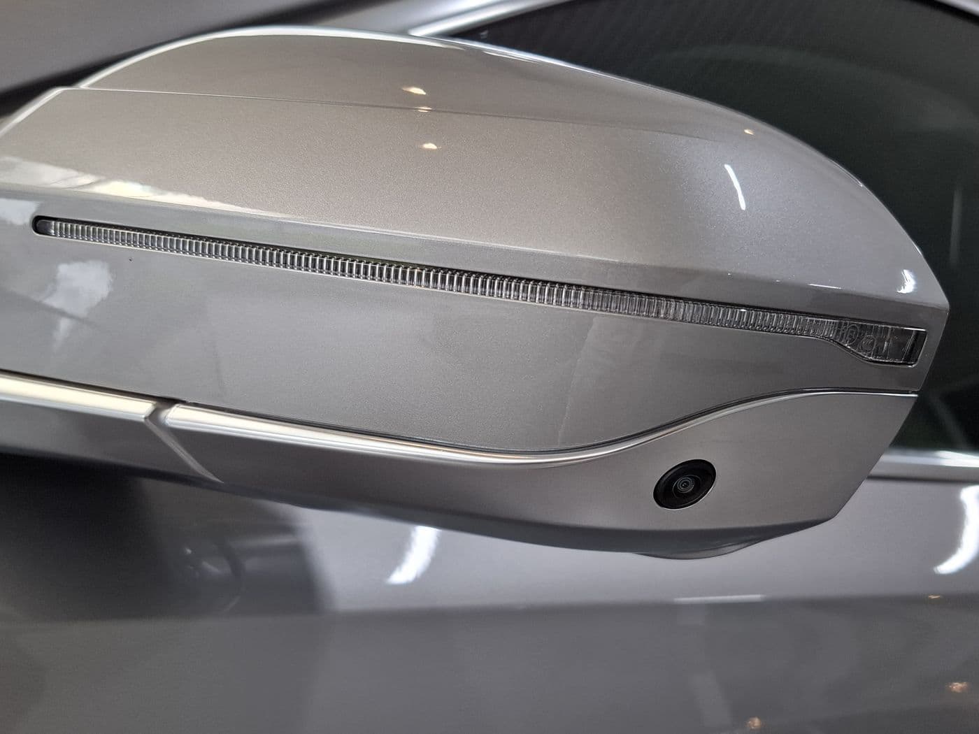 Side mirror on a grey car
